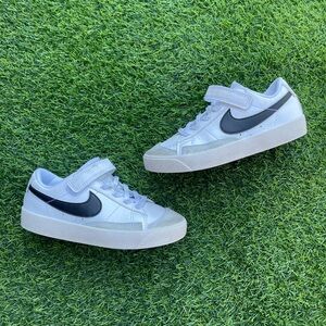Nike Kids White Sneakers with Black Swoosh and Strap